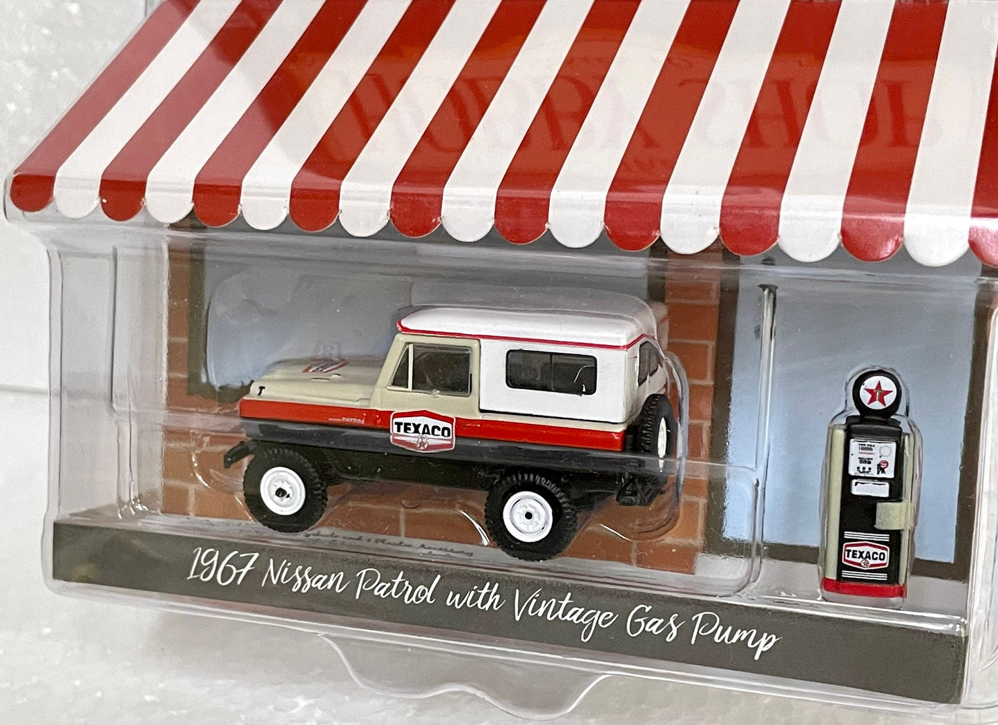 Greenlight Collectibles 1967 Nissan Patrol with vintage Gas Pump 1/64